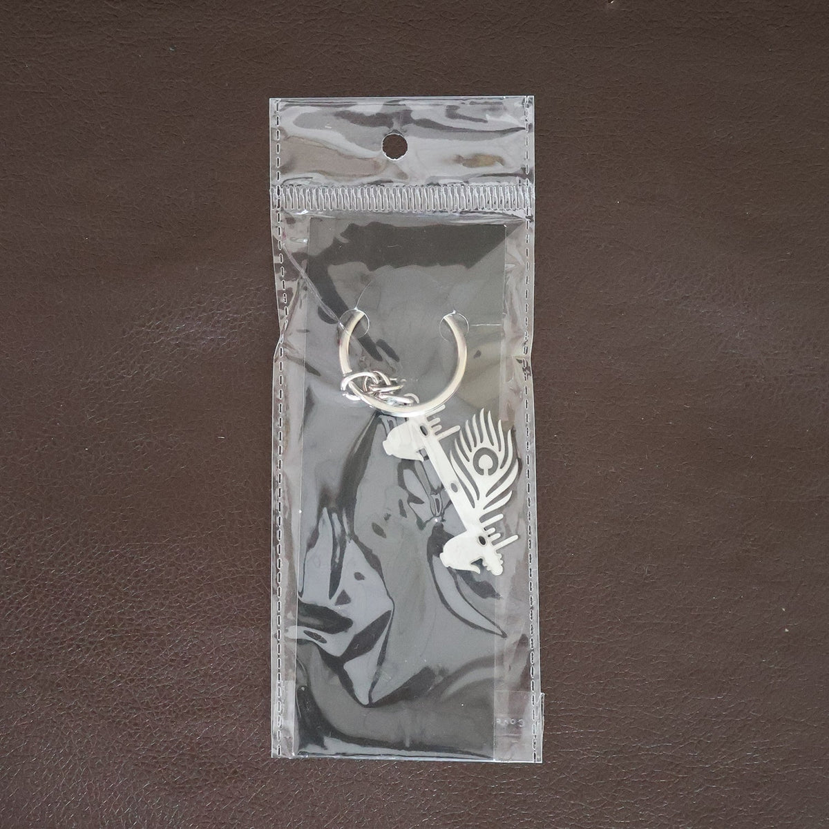Krishna Flute Keychain displayed in a lifestyle setting, perfect for daily use.