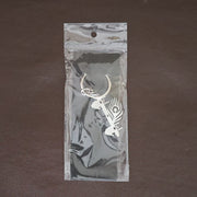 Krishna Flute Keychain displayed in a lifestyle setting, perfect for daily use.