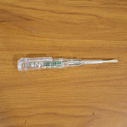 Digital voltage tester pen in use detecting a live wire with LED indication