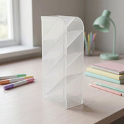 Plastic desk organizer holding office supplies in transparent compartments