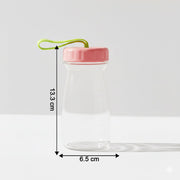 Close-up view of glass bottle topped with leak-proof silicone lid