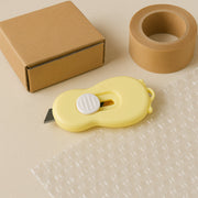 Side view of compact mini safety cutter with retractable sharp blade