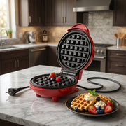 A Chef's Embrace Mini Waffle Maker preparing snacks on a kitchen counter.