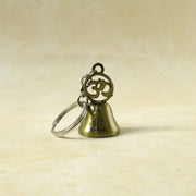 Om temple bell keychain used as decorative bag charm accessory