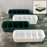 Four 5-compartment drawer organizers neatly stacked, storing socks and underwear.