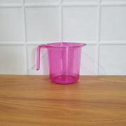 Plastic bathroom mug in a modern bathroom setting.