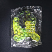 Lifestyle image of silicone pop it toy being used for relaxation and play