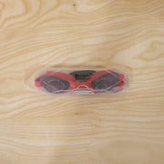 Swimmer using red anti-fog goggles in water environment