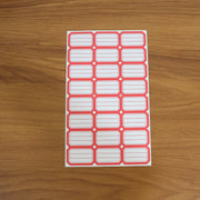 Various items organized and labeled using self-adhesive rectangular label stickers