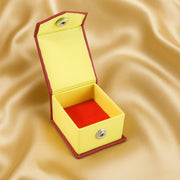Open ring gift box showing soft velvet cushion and snap closure