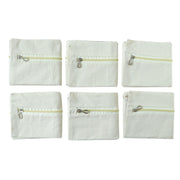 Six saree storage zipper pouches arranged for wardrobe organization