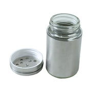 Close-up of stainless steel spice dispenser with sprinkle and pour openings