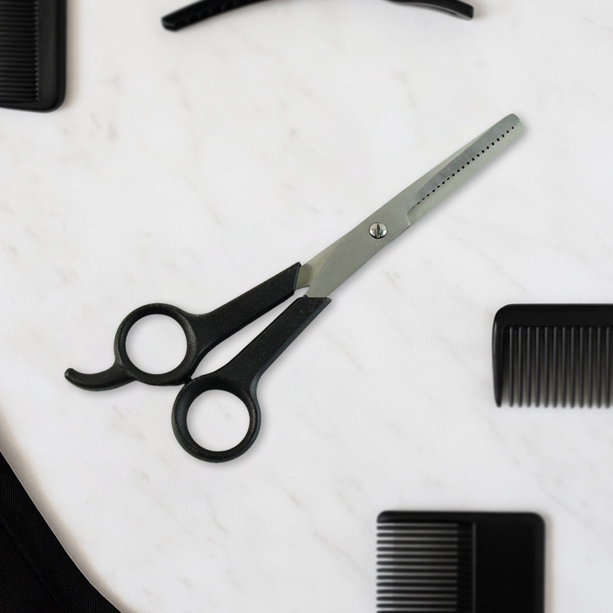 Hair thinning scissors showing detailed micro-toothed blade for bulk reduction