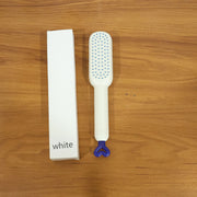 The Self-Cleaning Hairbrush removing trapped hair instantly after use