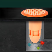 Transparent plastic drain strainer fitted in modern bathroom floor drain