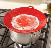 Silicone Spill Stopper Lid preventing boil-over on a cooking pot.