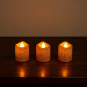 Safe flameless LED tealight candles with glitter finish on shelf