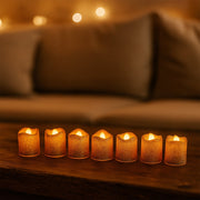 LED tealight candles arranged on festive table setting