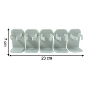 Wall mounted kitchen rack holding assorted spice jars