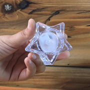 Close-up of star-shaped LED candle with realistic flickering flame