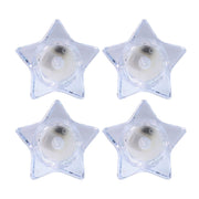 Flameless LED candles shaped like stars providing ambient light
