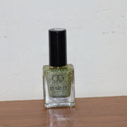Starlet glitter nail paint shimmering on nails in Sunshine Gold shade