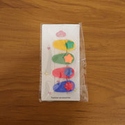 Lifestyle image showcasing colorful star hair clip set in use