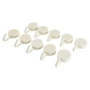 Adhesive round wall hooks organizing kitchen tools effectively