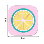 Bright yellow lemon silicone drink coaster displayed on coffee table