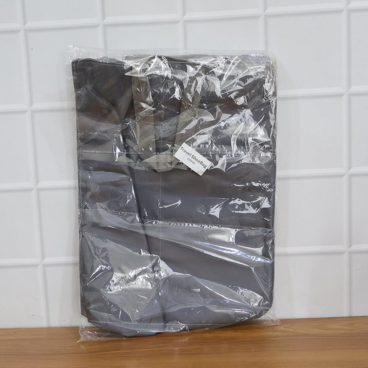 Travel shoe storage bag designed to keep footwear organized and clean