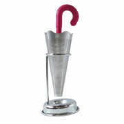 Stainless steel umbrella tea infuser resting securely on its dedicated drip tray stand, preventing spills.