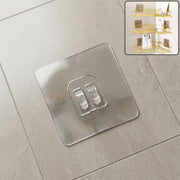 GlimmerHome transparent adhesive wall hook mounted on a clean, smooth wall.