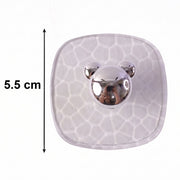 Side view showing clear adhesive wall hook mounted seamlessly on a wall.