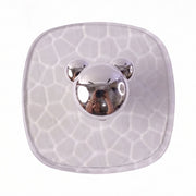 Multiple clear adhesive wall hooks installed discreetly on a bathroom wall.