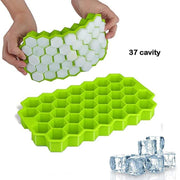 Green flexible silicone ice cube tray ready for filling.