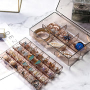 Close-up of the dustproof lid on the 2-layer acrylic jewelry organizer.