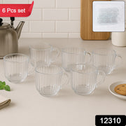 Close-up of ergonomic handle on transparent plastic tea cup