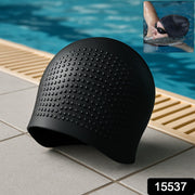 Swimmer wearing silicone swimming cap in pool water