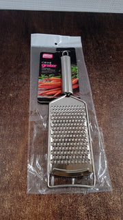 Neutral kitchen image showing stainless steel grater tool