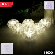 Close-up of crystal design LED flameless tealight candle glowing warmly