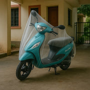 Small transparent waterproof plastic Activa bike cover protecting scooter from rain and dust