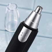 Cleaning brush included with the ear and nose hair trimmer for easy maintenance.