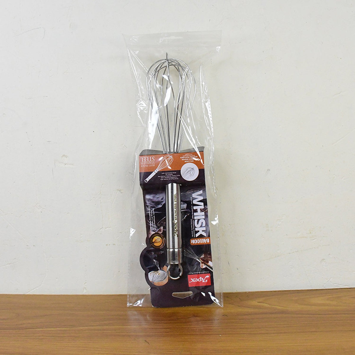 Large stainless steel hand whisk with hanging loop for storage