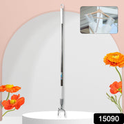 Woman effortlessly using the adjustable wardrobe reach pole to hang clothes.