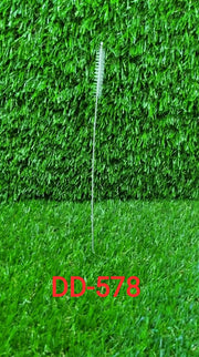 The 23cm long straw brush demonstrating flexible cleaning.