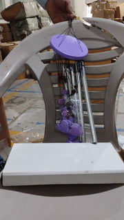Detailed view of the top hanging ring and bamboo structure of the wind chime.