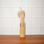 Natural bamboo cooking spatula set styled on kitchen counter