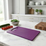 Unbreakable cutting board featuring built-in handle for portability