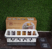 Hanging drain rack from Bathora, perfectly storing sponges and brushes for quick access.