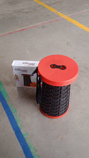 Close-up of the robust plastic material and sturdy construction of the retractable folding stool.
